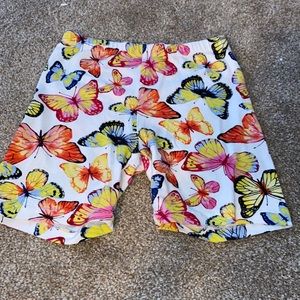 Biker shorts with colorful butterfly’s all over.